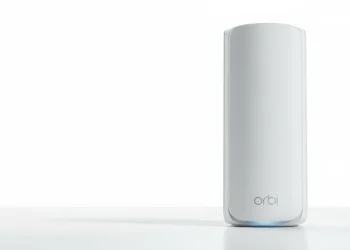 White Netgear Orbi mesh router unit standing on a white surface against a bright white studio background.