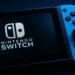 Nintendo Switch console showing white logo on a dark screen.