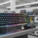 RedThunder K10 budget gaming keyboard and mouse on a store display stand.