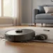 Frustrated homeowner holding a regular vacuum while a robot vacuum sits tangled on a cluttered living room floor, missing dirt patches.