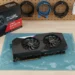 Top-down view of Asus RX 6700 XT on anti-static bag and box on PC workbench.
