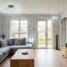 Modern living room with digital smart home automation icons over sofa and TV